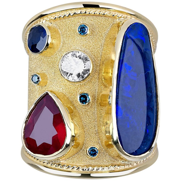 18 Karat Gold Ring with Opal Ruby Sapphire and Blue Diamond