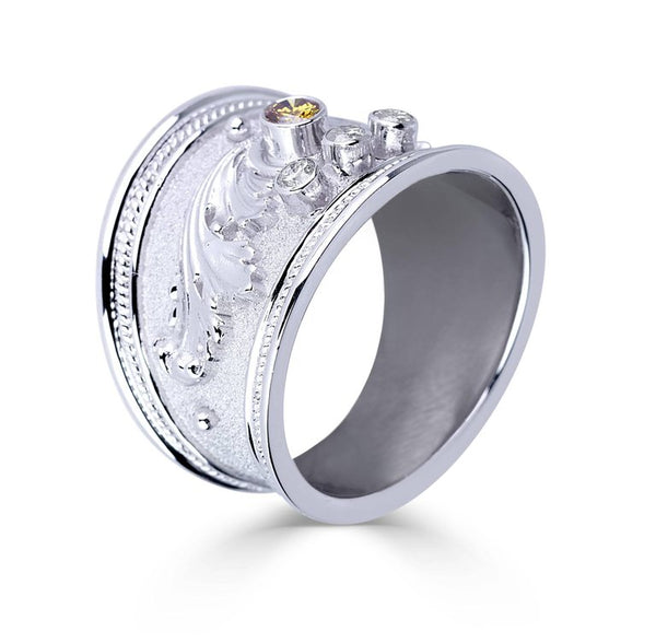 18 Karat White Gold Diamond Band Ring with a Yellow Diamond