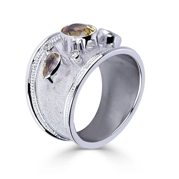 18 Karat White Gold Diamond Ring with Olive Green Sapphires