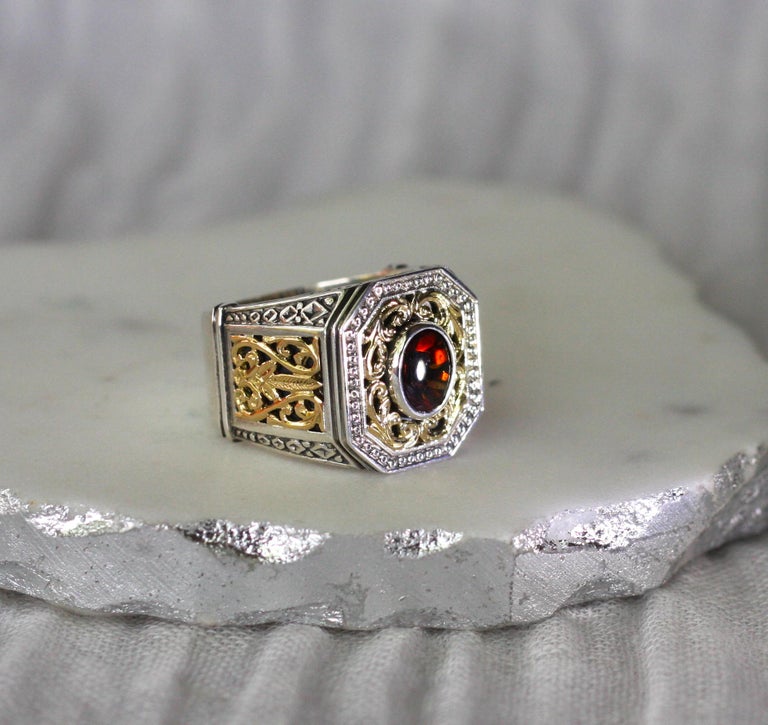 18 Karat Gold and Silver Ring with Garnet
