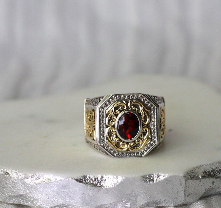 18 Karat Gold and Silver Ring with Garnet