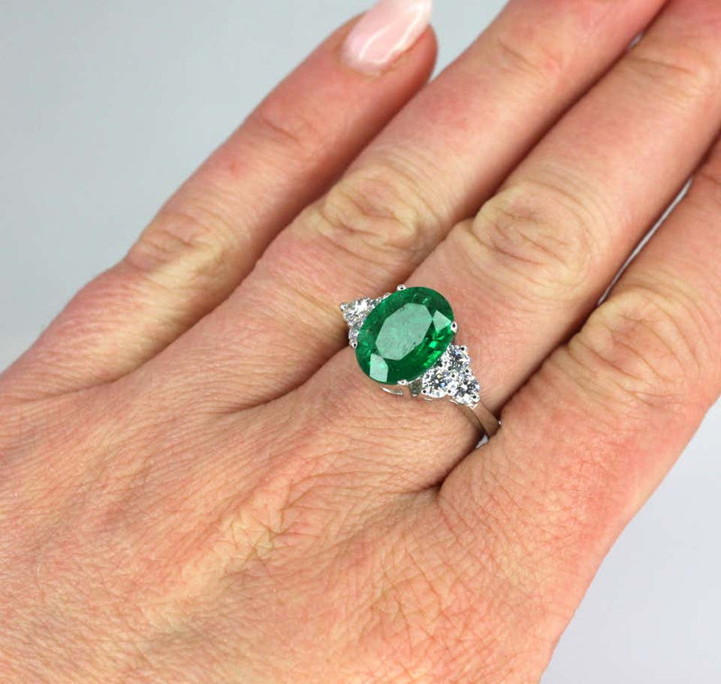 18 Karat White Gold Oval Natural Emerald and Diamond Ring